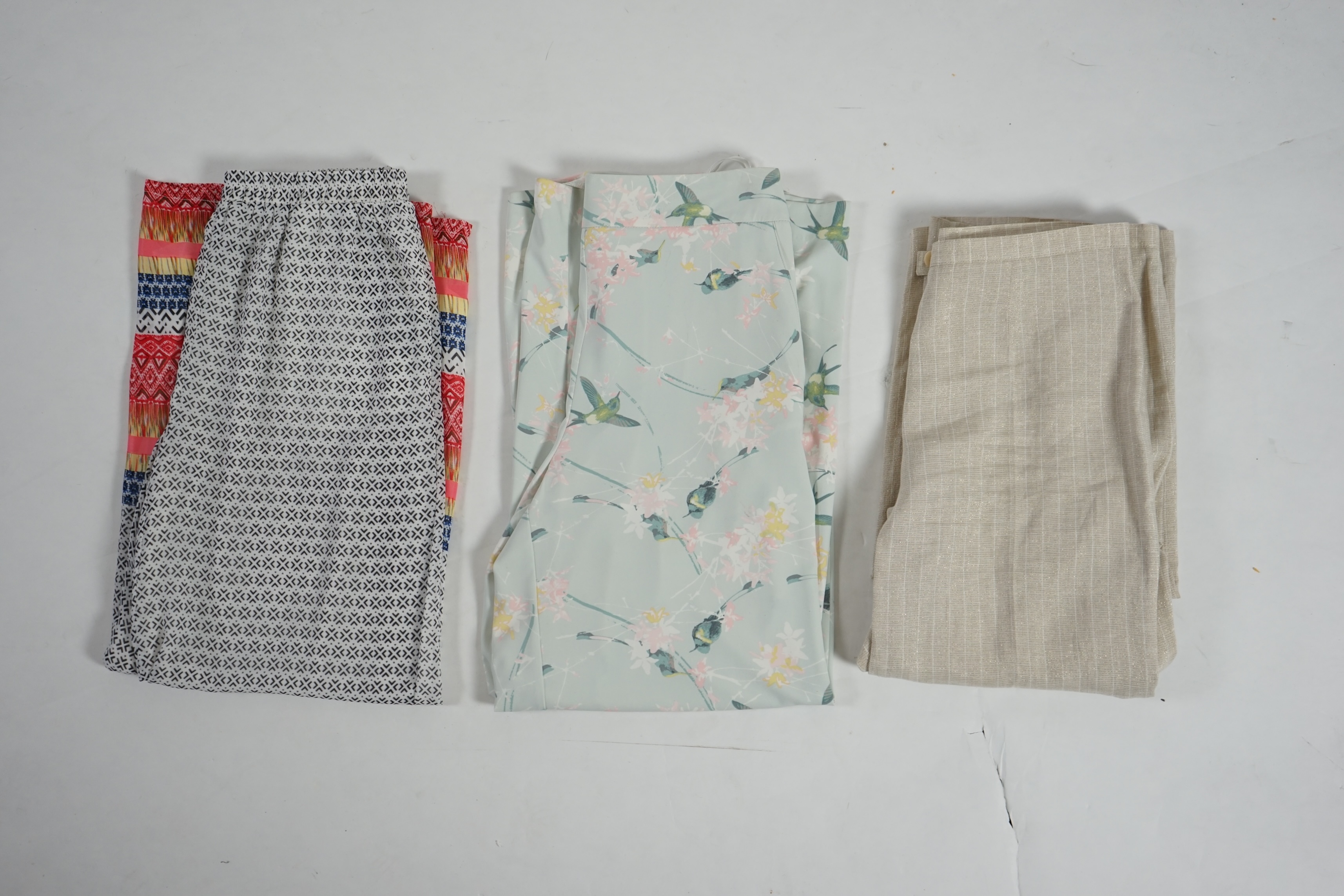 Three pairs of lady's casual trousers. Approx size 14-16 Proceeds to Happy Paws Puppy Rescue